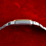 Profil gauche du boîtier Cartier Santos Galbée en acier et or jaune, montre vintage