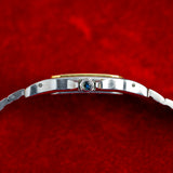 Profil côté couronne de la Cartier Santos Galbée, couronne à cabochon bleu, montre ancienne