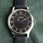 Mostrador preto granulado do Jaeger-LeCoultre E159, algarismos arábicos, relógio vintage