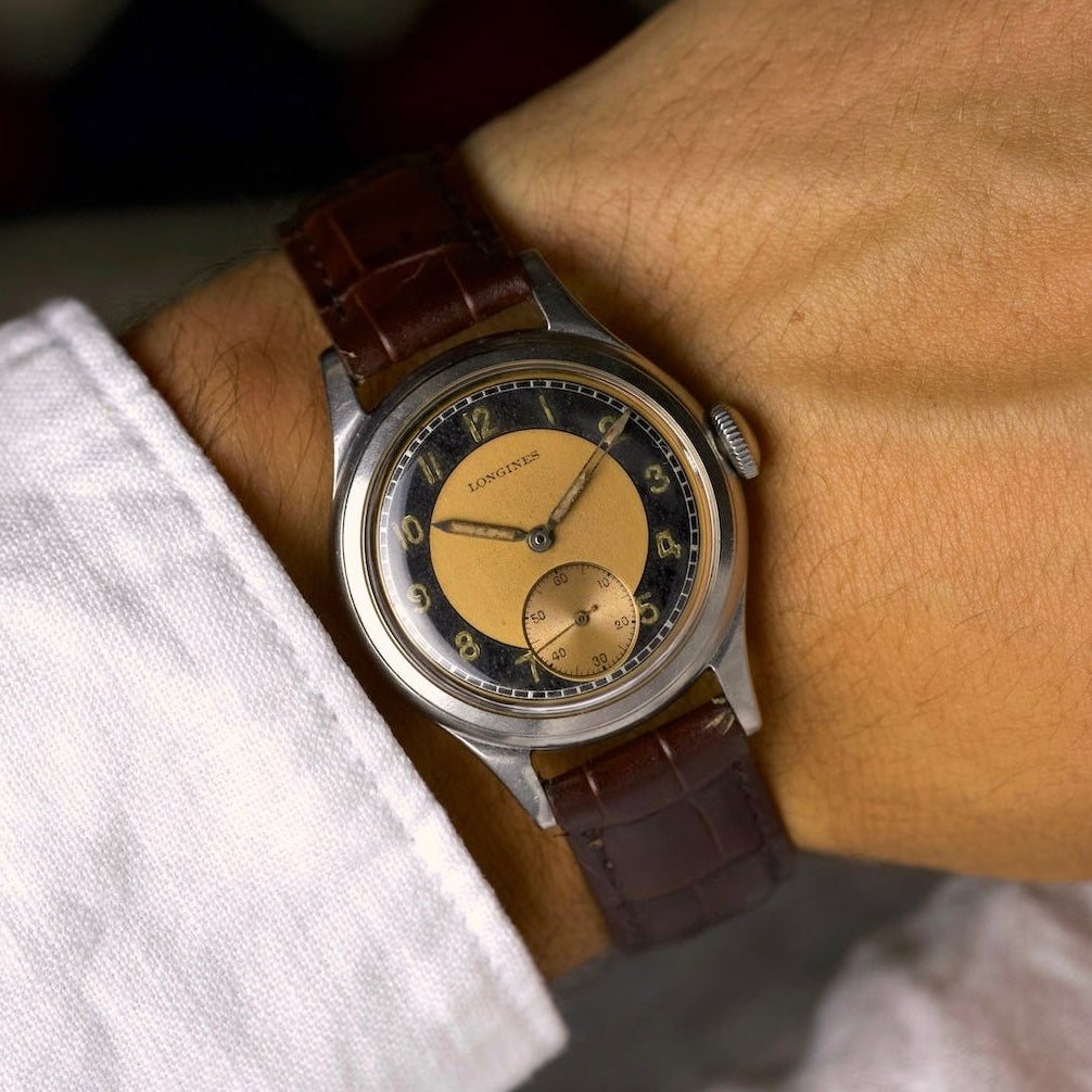 Montre vintage Longines Sei Tacche de 1945 au poignet, cadran bullseye cuivré et noir