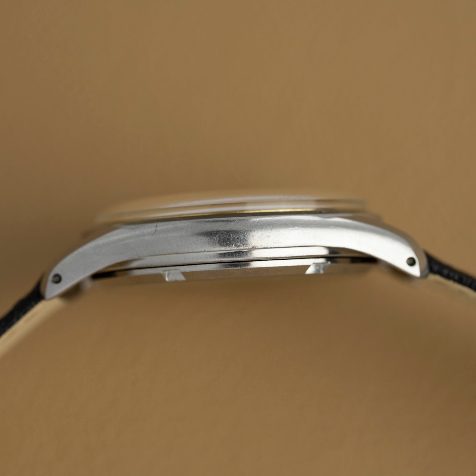 Left profile of the steel case of the 1952 Omega Jumbo, vintage watch