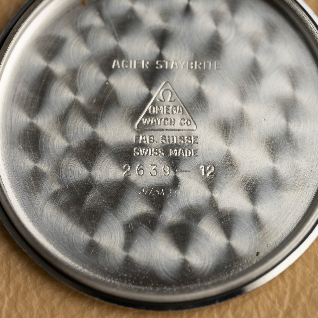 Inside of the Omega 2639-12 caseback, hallmarks and reference, vintage watch