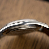 Left profile of the steel case of the 1960 Zenith Pilot, vintage watch