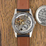 Zenith Pilot opened, movement visible next to the caseback, vintage watch