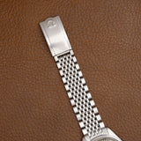 Fermoir signé Omega du bracelet acier grains de riz, montre vintage