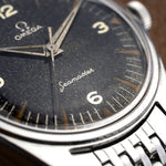 Cadran noir stardust de l'Omega Ranchero, chiffres 3, 6 et signature Seamaster, montre vintage