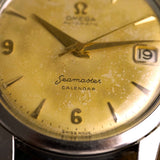Firma Seamaster Calendar y fecha en la esfera dorada del Omega 1956, reloj antiguo